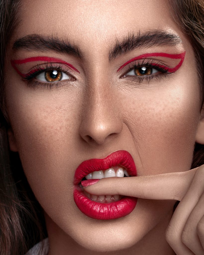 model with bold red graphic liner